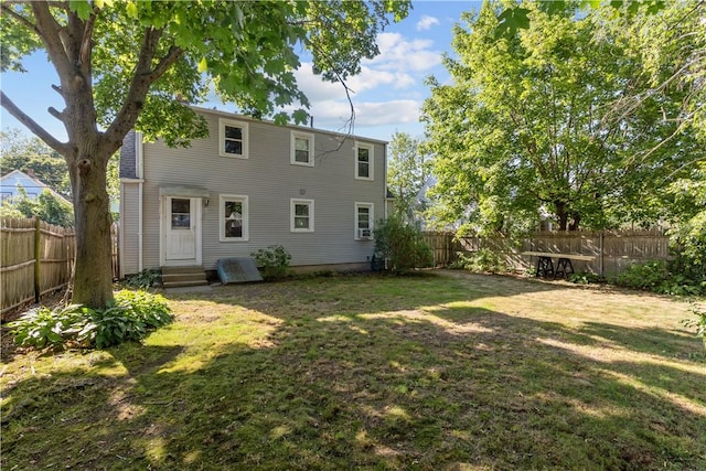 74 Park View Blvd, Cranston, RI 02910 - rear view of house with a fenced backyard and entry steps