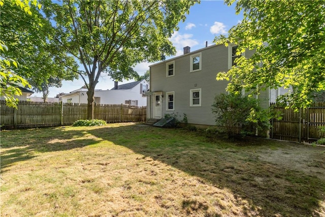 74 Park View Blvd, Cranston, RI 02910 - back of property featuring a fenced backyard and a chimney