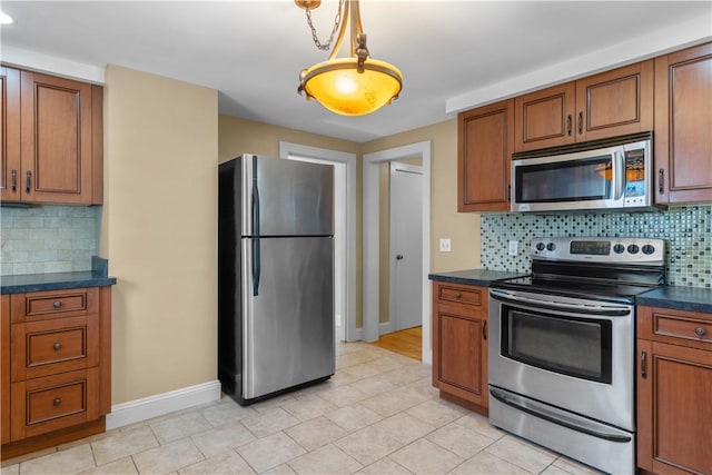 74 Park View Blvd, Cranston, RI 02910 - kitchen with appliances with stainless steel finishes, dark countertops, brown cabinets, and tasteful backsplash