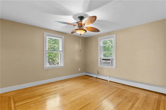 74 Park View Blvd, Cranston, RI 02910 - empty room featuring baseboard heating, cooling unit, plenty of natural light, and wood finished floors