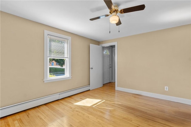 74 Park View Blvd, Cranston, RI 02910 - empty room featuring a baseboard heating unit, wood finished floors, and a ceiling fan