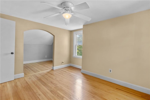 74 Park View Blvd, Cranston, RI 02910 - empty room featuring arched walkways, light wood finished floors, and a ceiling fan