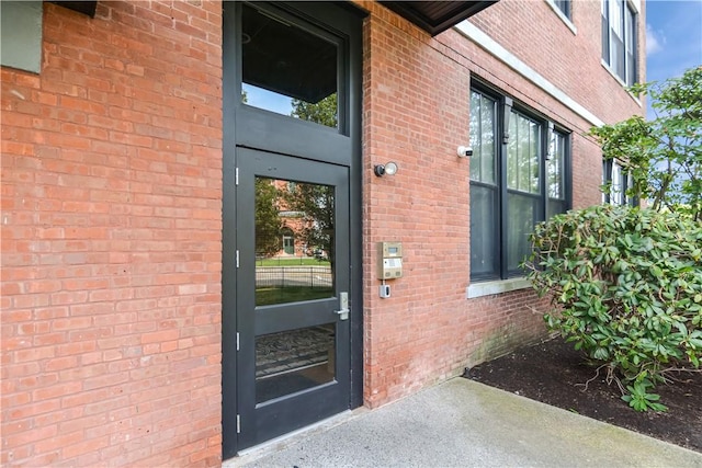 685 Social St Unit 103, Woonsocket, RI 02895 - doorway to property with brick siding
