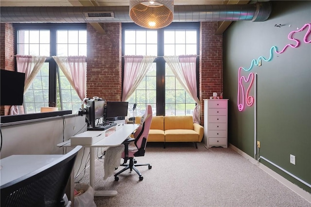 685 Social St Unit 103, Woonsocket, RI 02895 - carpeted home office with plenty of natural light and brick wall