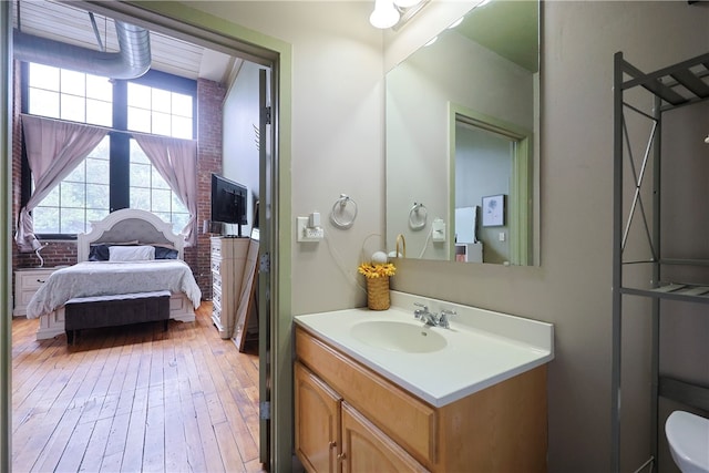 685 Social St Unit 103, Woonsocket, RI 02895 - bathroom with vanity, hardwood / wood-style floors, and ensuite bathroom
