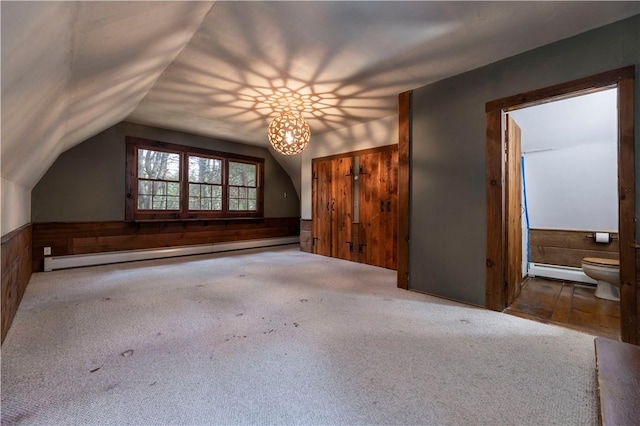 84 Skunk Hill Rd, Hopkinton, RI 02832 - bonus room with a baseboard radiator, wood walls, lofted ceiling, wainscoting, and carpet floors