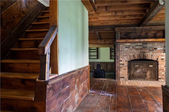 84 Skunk Hill Rd, Hopkinton, RI 02832 - unfurnished living room featuring stairs, dark wood-style floors, a wooden ceiling with exposed beams, and wood walls