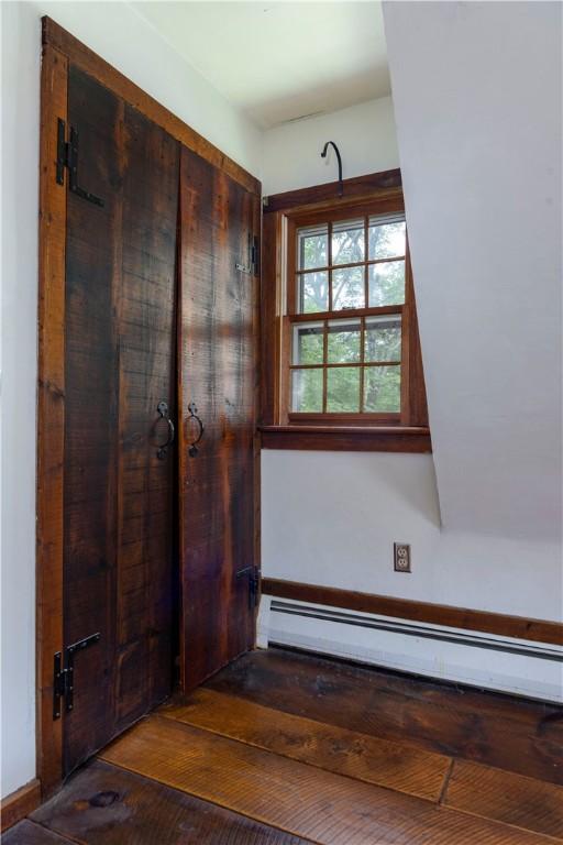 84 Skunk Hill Rd, Hopkinton, RI 02832 - foyer featuring a baseboard radiator and hardwood / wood-style floors
