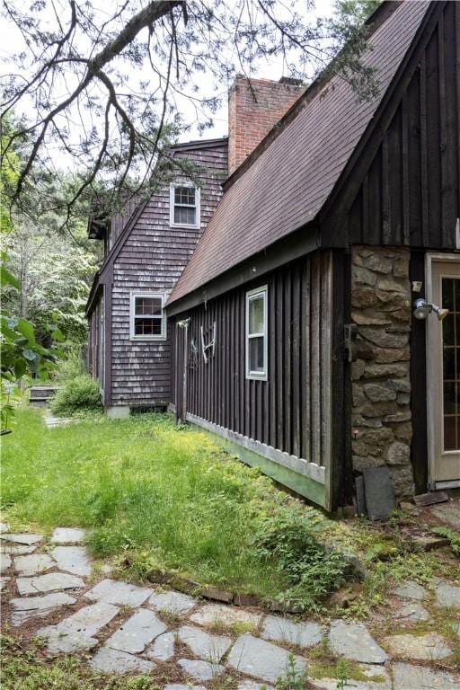 84 Skunk Hill Rd, Hopkinton, RI 02832 - view of property exterior featuring a chimney and a shingled roof