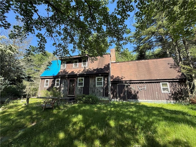 84 Skunk Hill Rd, Hopkinton, RI 02832 - rear view of house featuring a yard and a chimney