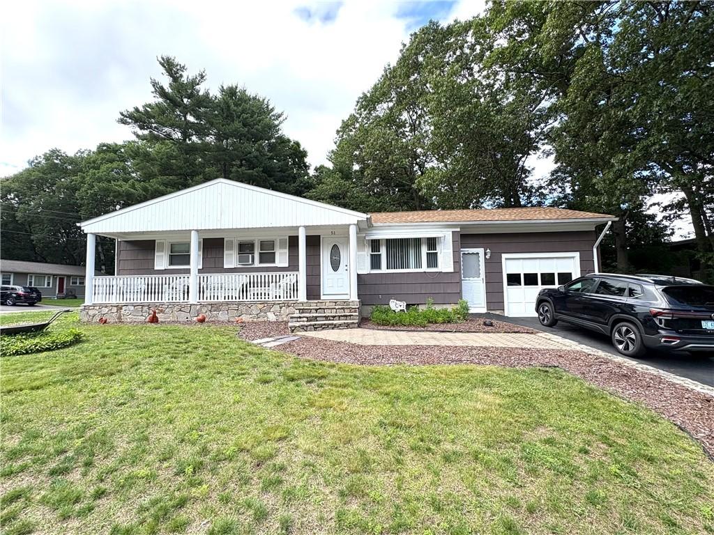 51 Old Carriage Rd, West Warwick, RI 02893 - ranch-style home with covered porch, a garage, driveway, and a front yard