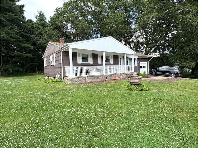 51 Old Carriage Rd, West Warwick, RI 02893 - view of front of house with covered porch, a garage, a chimney, and a front yard