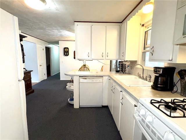 51 Old Carriage Rd, West Warwick, RI 02893 - kitchen featuring white appliances, white cabinetry, light countertops, and dark carpet