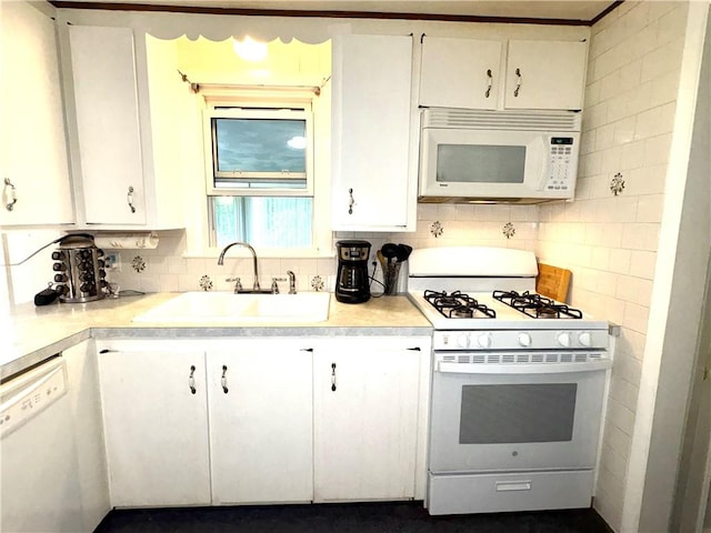 51 Old Carriage Rd, West Warwick, RI 02893 - kitchen featuring white appliances, white cabinets, light countertops, and decorative backsplash