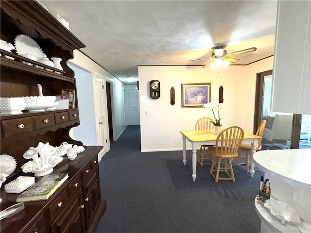 51 Old Carriage Rd, West Warwick, RI 02893 - dining room featuring a ceiling fan and dark colored carpet