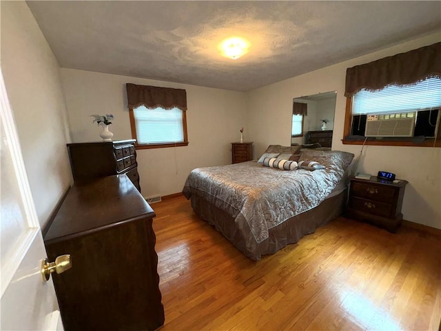 51 Old Carriage Rd, West Warwick, RI 02893 - bedroom featuring light wood-style floors and cooling unit