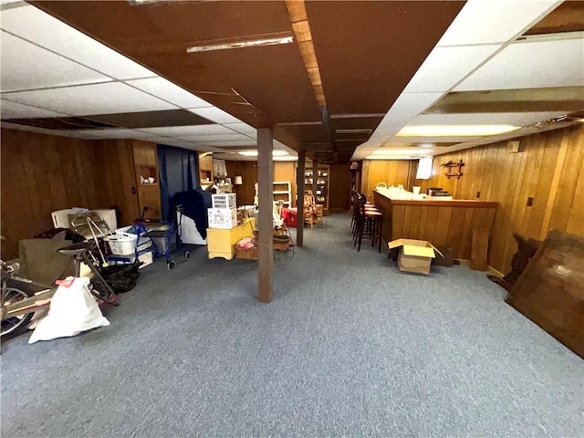51 Old Carriage Rd, West Warwick, RI 02893 - finished below grade area featuring wood walls, a dry bar, carpet floors, and a drop ceiling