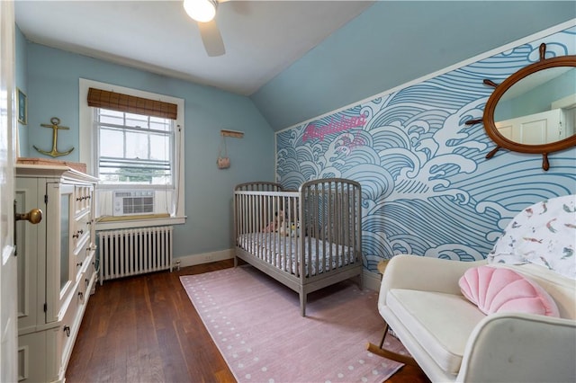 39 Chester Ave, Westerly, RI 02891 - bedroom with radiator, dark wood finished floors, cooling unit, vaulted ceiling, and a ceiling fan