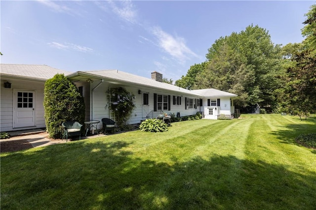 38 Setting Sun Dr, Westerly, RI 02891 - rear view of property featuring a lawn and a chimney