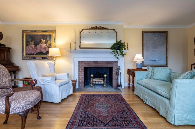 38 Setting Sun Dr, Westerly, RI 02891 - living room featuring wood finished floors, crown molding, and a fireplace