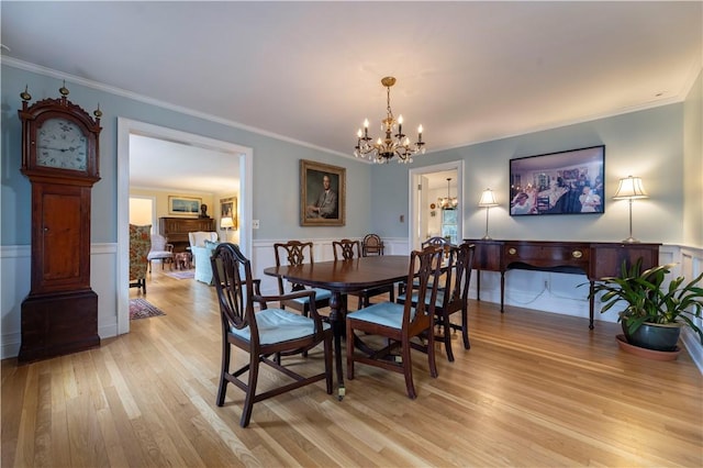 38 Setting Sun Dr, Westerly, RI 02891 - dining room featuring a chandelier, light wood-style flooring, wainscoting, and crown molding
