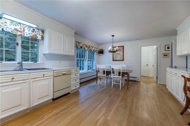 38 Setting Sun Dr, Westerly, RI 02891 - kitchen with white dishwasher, a chandelier, ornamental molding, baseboard heating, and light countertops