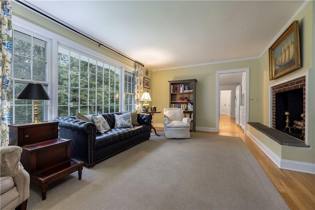 38 Setting Sun Dr, Westerly, RI 02891 - living area with crown molding, light wood-type flooring, and a brick fireplace