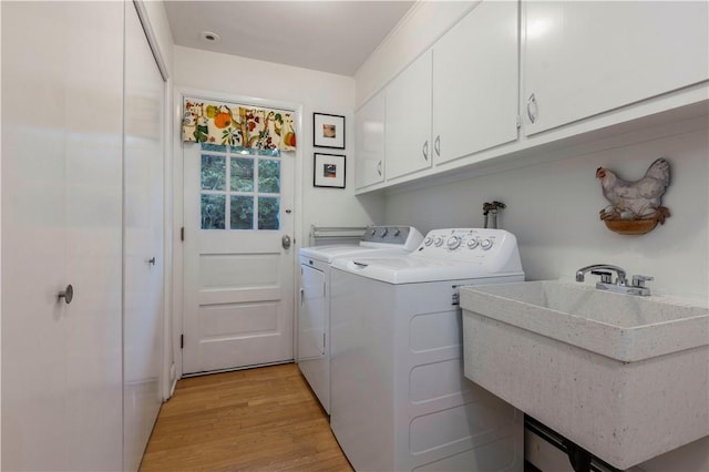 38 Setting Sun Dr, Westerly, RI 02891 - laundry area with cabinet space, washing machine and dryer, and light wood-style floors
