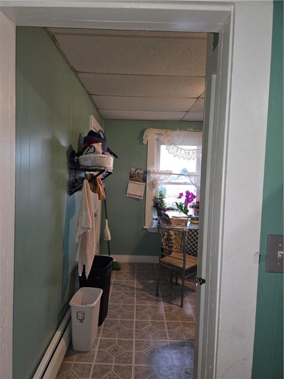 33 Chambers St, Providence, RI 02907 - corridor featuring a drop ceiling, baseboard heating, and tile patterned flooring
