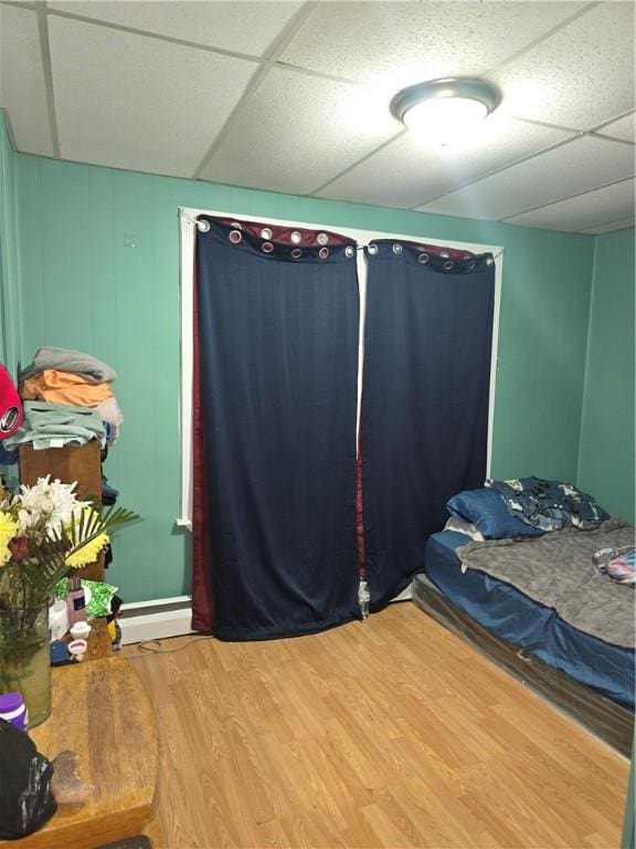 33 Chambers St, Providence, RI 02907 - bedroom featuring a drop ceiling, wood finished floors, and a decorative wall