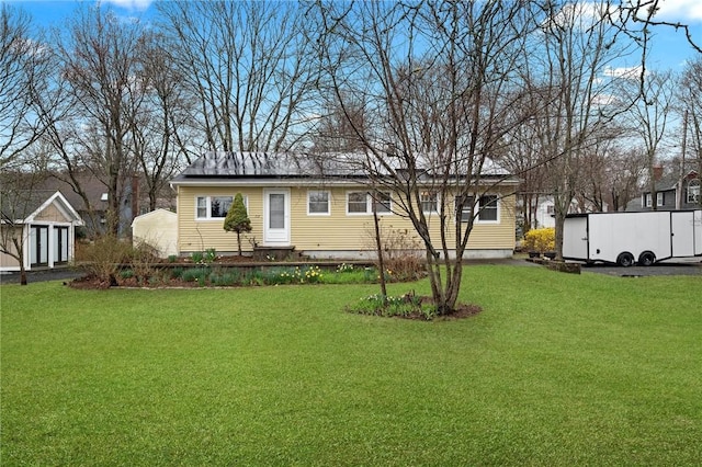 1737 Wampanoag Trl, Barrington, RI 02806 - rear view of house featuring a yard