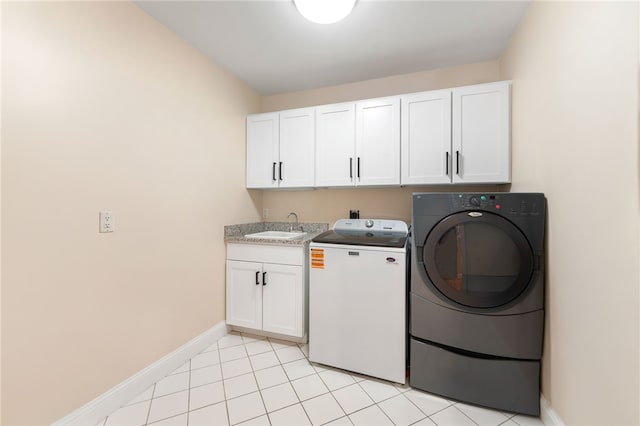27 Eagle Dr, North Kingstown, RI 02852 - laundry room with separate washer and dryer, cabinet space, and light tile patterned floors