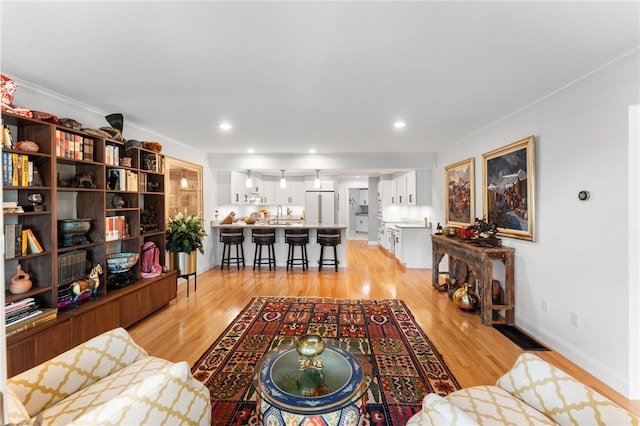 27 Eagle Dr, North Kingstown, RI 02852 - living area with light wood-type flooring, crown molding, and recessed lighting
