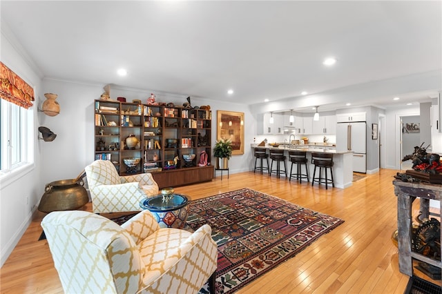 27 Eagle Dr, North Kingstown, RI 02852 - living area with light wood-type flooring, crown molding, and recessed lighting