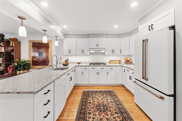 27 Eagle Dr, North Kingstown, RI 02852 - kitchen featuring white appliances, under cabinet range hood, ornamental molding, light wood finished floors, and a peninsula