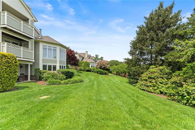 27 Eagle Dr, North Kingstown, RI 02852 - view of grassy yard with a balcony