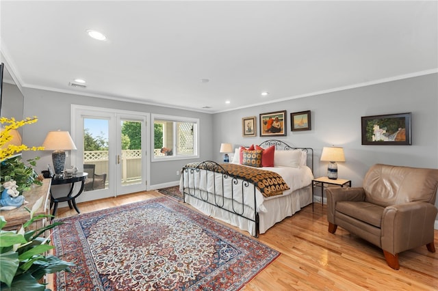 27 Eagle Dr, North Kingstown, RI 02852 - bedroom featuring access to outside, crown molding, wood finished floors, recessed lighting, and french doors