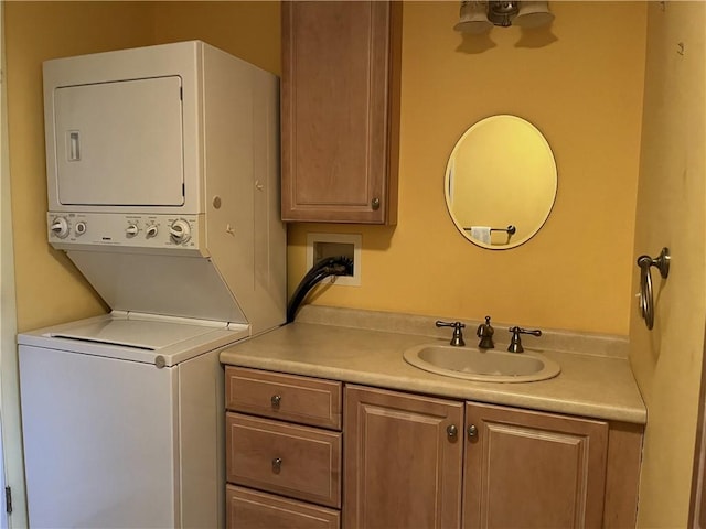 10 Cavalier Rd, Narragansett, RI 02882 - laundry room with stacked washer and clothes dryer and cabinet space