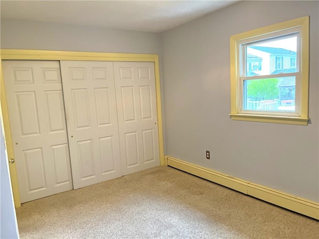 10 Cavalier Rd, Narragansett, RI 02882 - unfurnished bedroom featuring baseboard heating and a closet