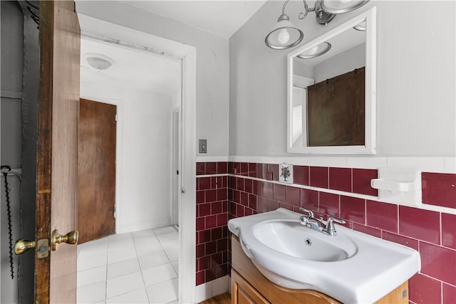 509 W Shore Rd, Warwick, RI 02889 - bathroom featuring vanity, tile walls, tile patterned flooring, and wainscoting
