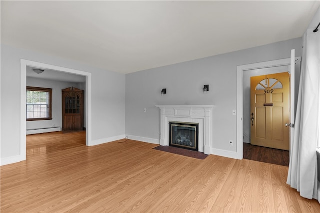 509 W Shore Rd, Warwick, RI 02889 - unfurnished living room with baseboard heating, light wood-style flooring, and a fireplace with flush hearth