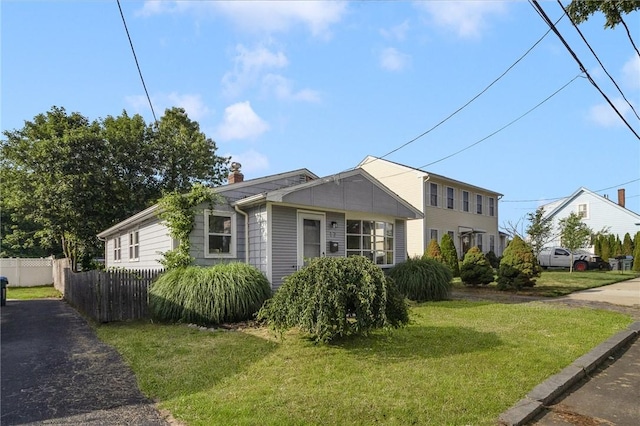 17 Victor Emanuel Ave, Providence, RI 02904 - view of front of home with asphalt driveway and a chimney