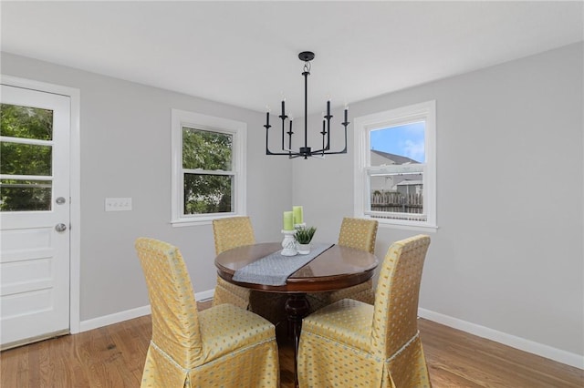 17 Victor Emanuel Ave, Providence, RI 02904 - dining space featuring a chandelier and wood finished floors