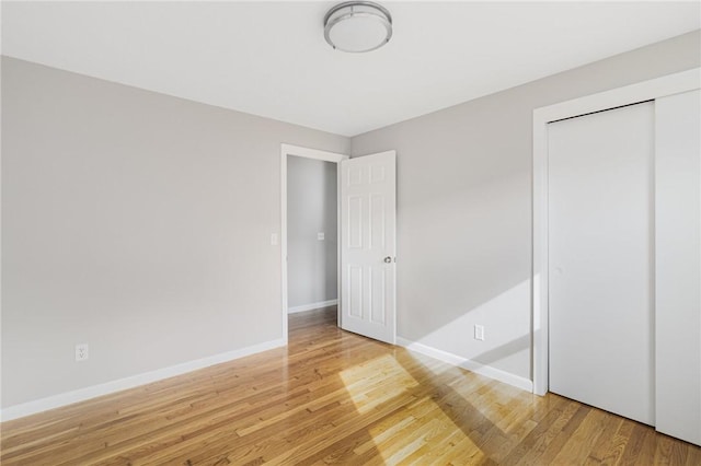 17 Victor Emanuel Ave, Providence, RI 02904 - unfurnished bedroom featuring light wood-style flooring and a closet