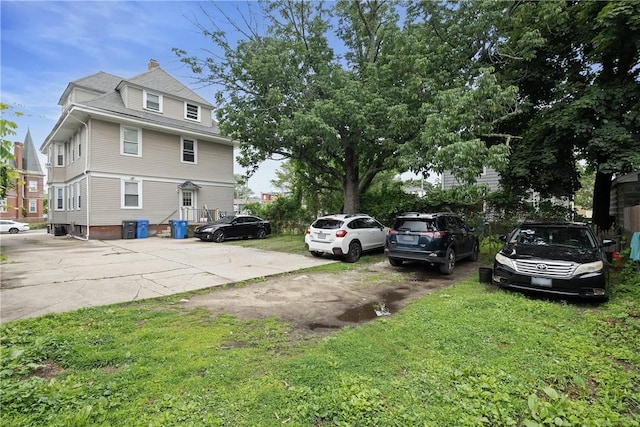 10 Sylvan Ave, Cranston, RI 02905 - view of home's exterior featuring uncovered parking and a lawn