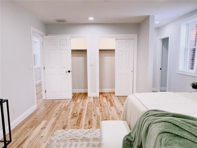 945 Danielson Pike, Scituate, RI 02857 - bedroom featuring multiple closets, light wood-style flooring, and recessed lighting