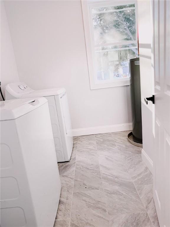 945 Danielson Pike, Scituate, RI 02857 - laundry area featuring washer and dryer, water heater, and light marble finish floors