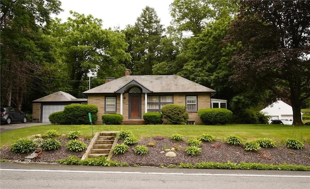 318 Saint Paul St, North Smithfield, RI 02896 - view of front of home with a front lawn, a detached garage, and a chimney