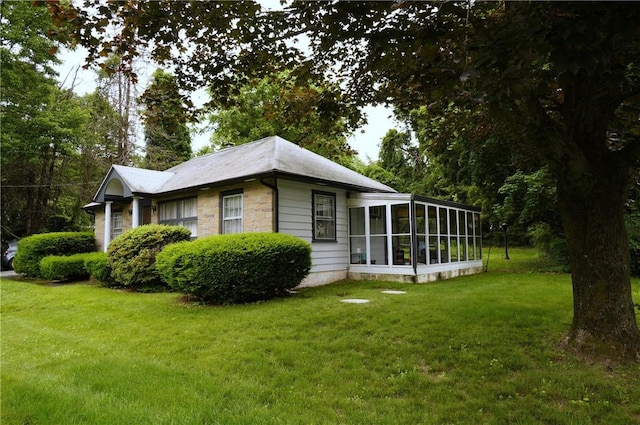 318 Saint Paul St, North Smithfield, RI 02896 - view of side of home with a sunroom and a yard