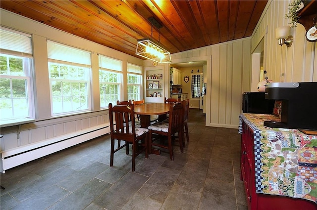 318 Saint Paul St, North Smithfield, RI 02896 - dining room featuring baseboard heating, wooden ceiling, and dark stone finish floors